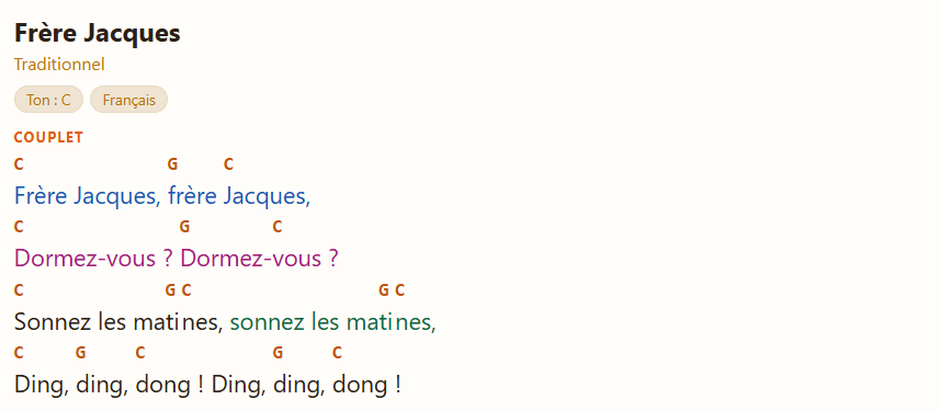 Page de la chanson d’exemple : la première ligne en bleu (teinte 1), la deuxième en rose (teinte 2) et la fin de la troisième en vert (teinte 3) ; les accords gardent leur couleur.